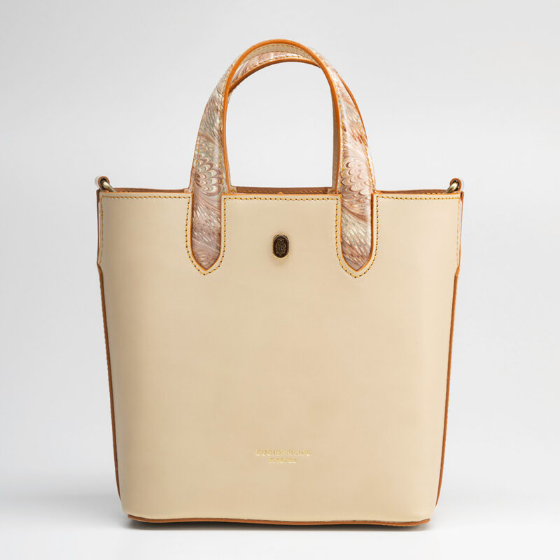 Italian vegetable tanned mini shopping bag leather from one of the most historic Tuscany tannery with light camel patent interior. Handcrafted marbeled details on the handles and the closure flap. Ivory