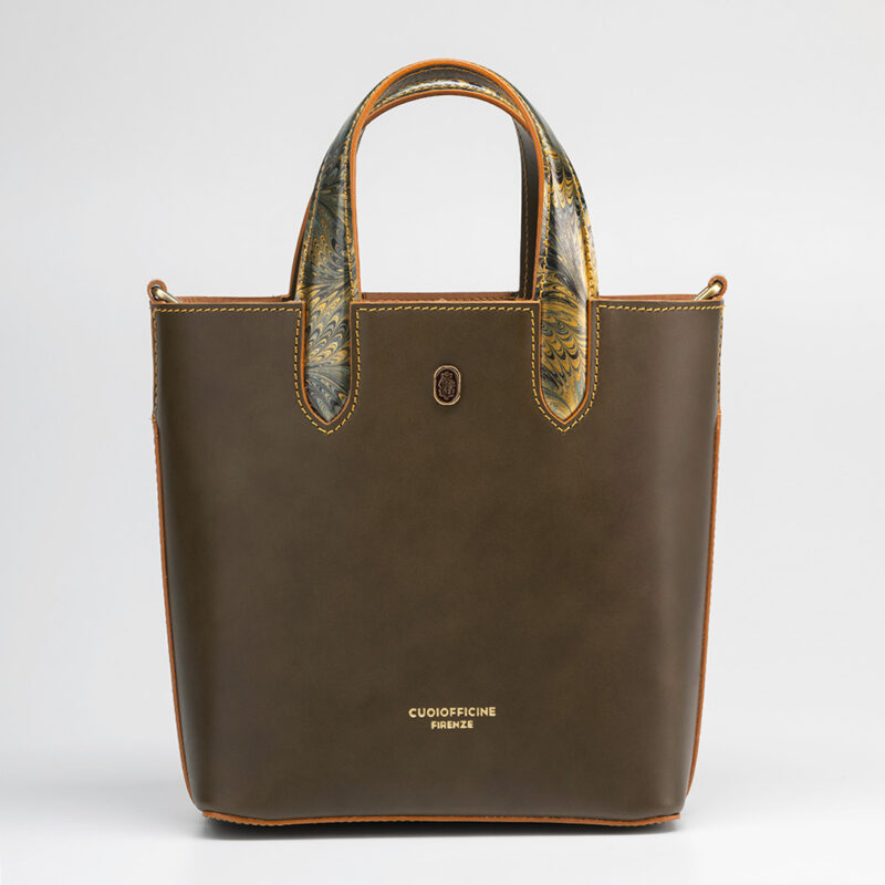 Italian vegetable tanned mini shopping bag leather from one of the most historic Tuscany tannery with light camel patent interior. Handcrafted marbeled details on the handles and the closure flap. Olivine